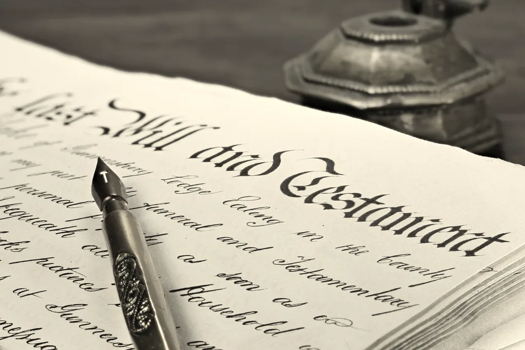 Last will and testament document with a fountain pen, illustrating probate and deceased estate administration